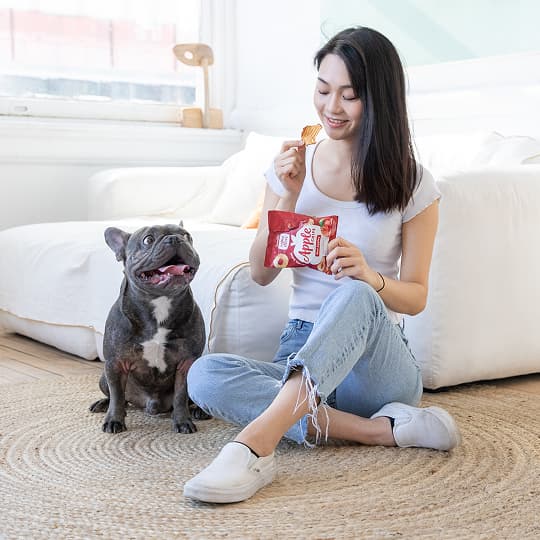 Woman eating Simple Slices Apple Chips